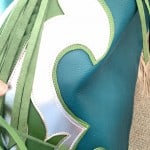 If you want a pair of bright blue and green chaps with fringe, you can have them!